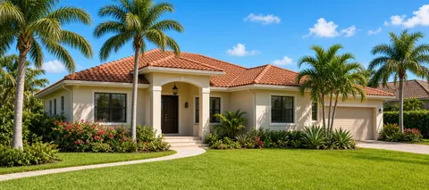 Bright Florida home with palm trees and a sunny front lawn